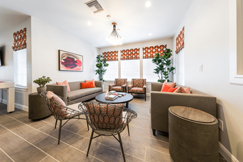 the living room at the enclave at woodbridge apartments in sugar land, tx