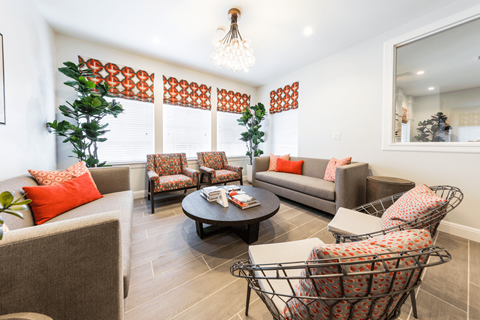 a living room with couches chairs and a coffee table