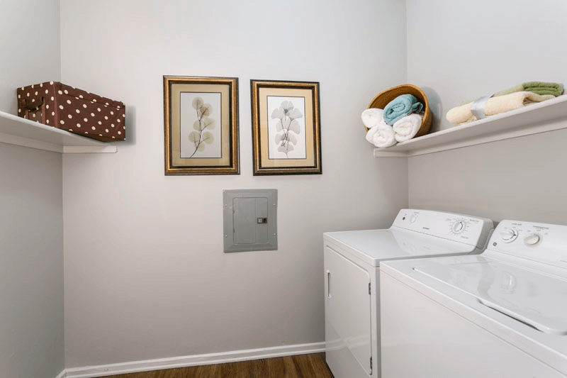 our apartments showcase a utility room with a washer and dryer