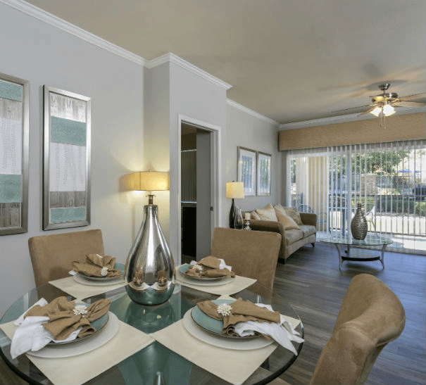a living room with a table and chairs