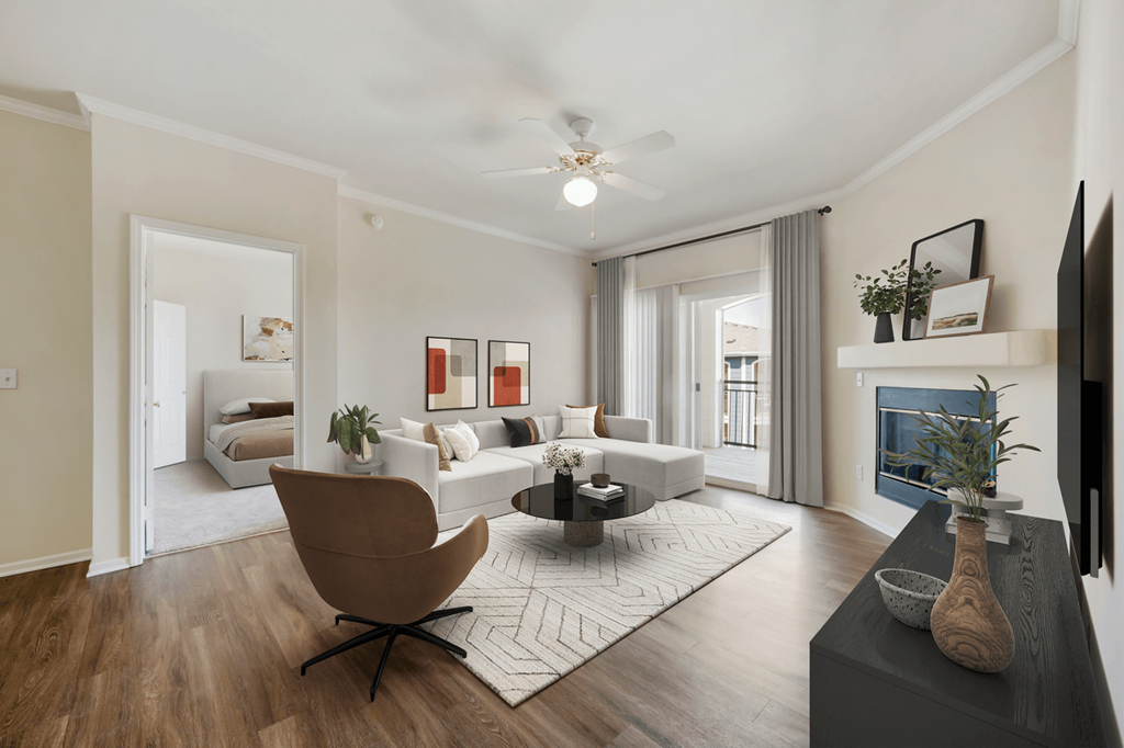 a living room with white walls and hardwood flooring