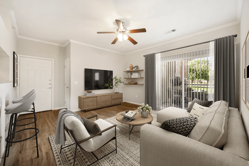 a living room with white walls and a ceiling fan