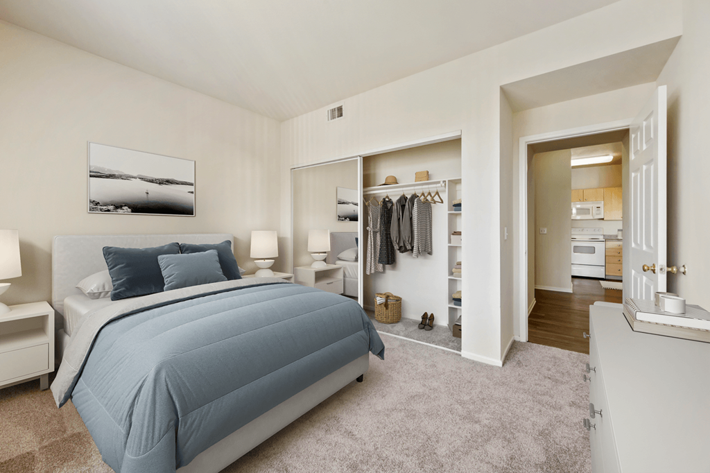 a bedroom with a bed and a closet