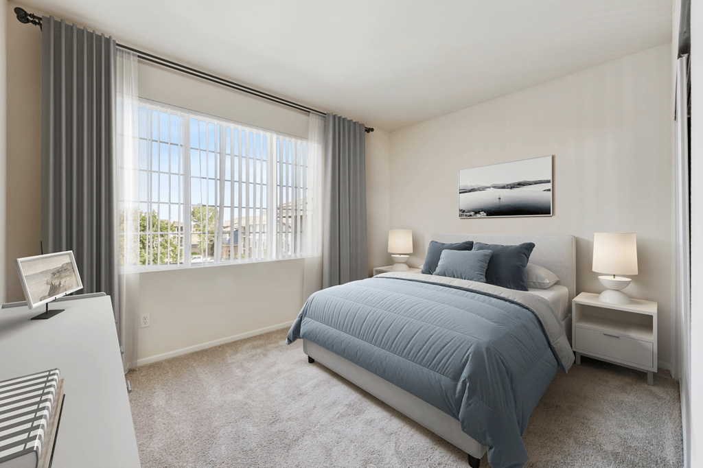 a bedroom with a bed and a window