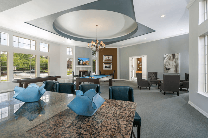 a large room with a ping pong table and a pool table