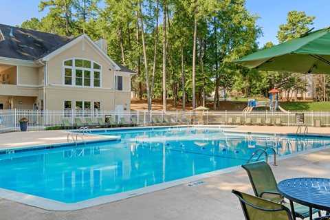 A large house with a pool in the backyard.