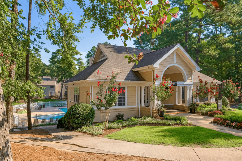 A house with a pool in the backyard at Regency Park Apartment Homes, Raleigh, NC