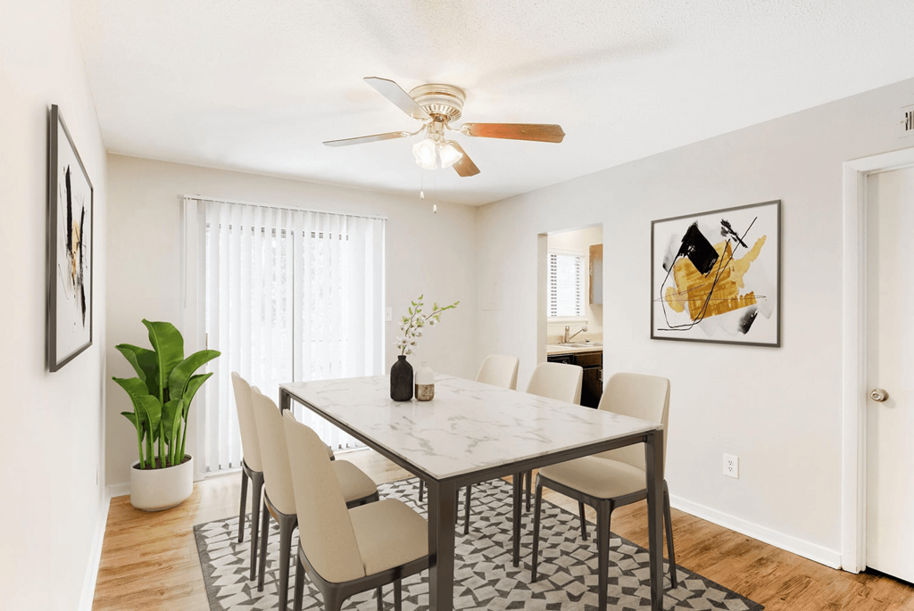 A dining room with a table and chairs at Regency Park Apartment Homes, Raleigh, NC