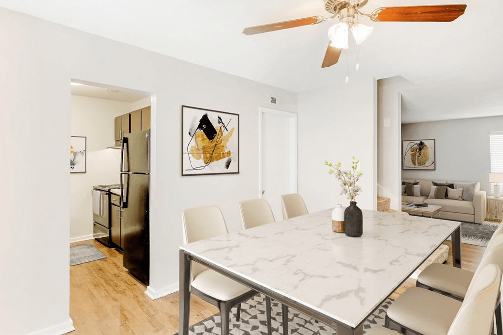 A dining room with a marble table and chairs at Regency Park Apartment Homes, North Carolina, 27616