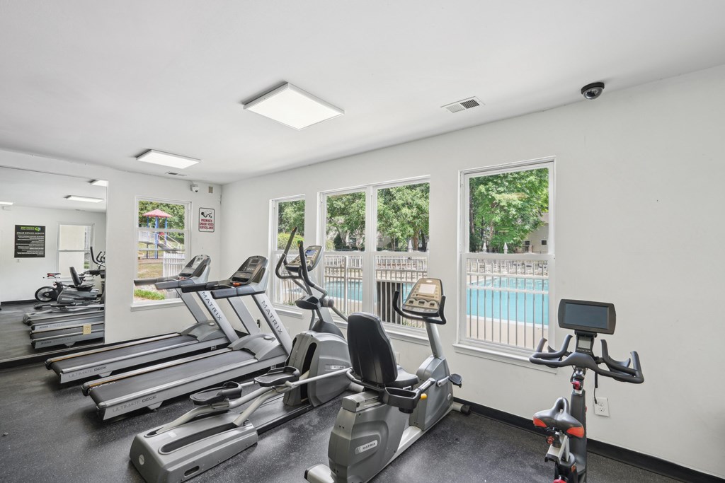 A gym with treadmills and exercise bikes at Regency Park Apartment Homes, Raleigh, NC