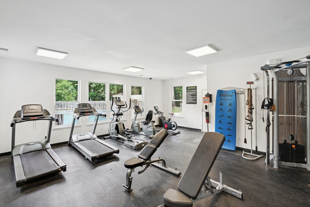 A gym with treadmills, weights, and exercise equipment at Regency Park Apartment Homes, North Carolina, 27616