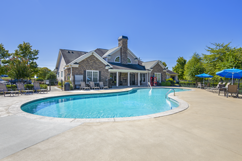 A large house with a pool in the backyard.