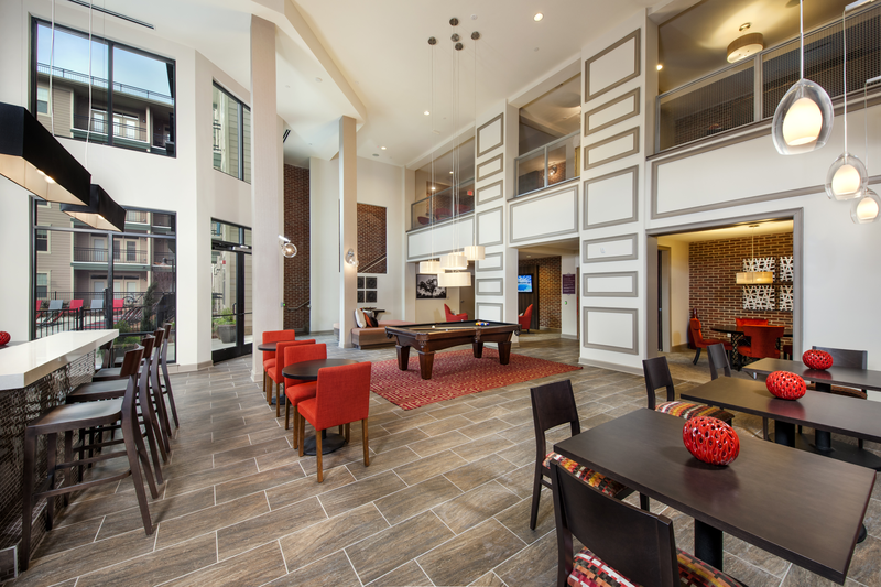 Leasing office interior facing resident lounge and office space