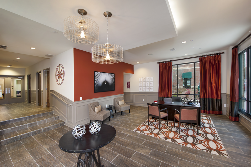 Leasing office area facing desk and sitting area