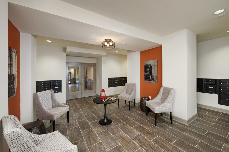 Resident mail room with two sitting areas