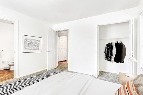 Spacious bedroom with walk-in closet and ensuite bathroom at Riverwalk Apartments, Brighton, 80601