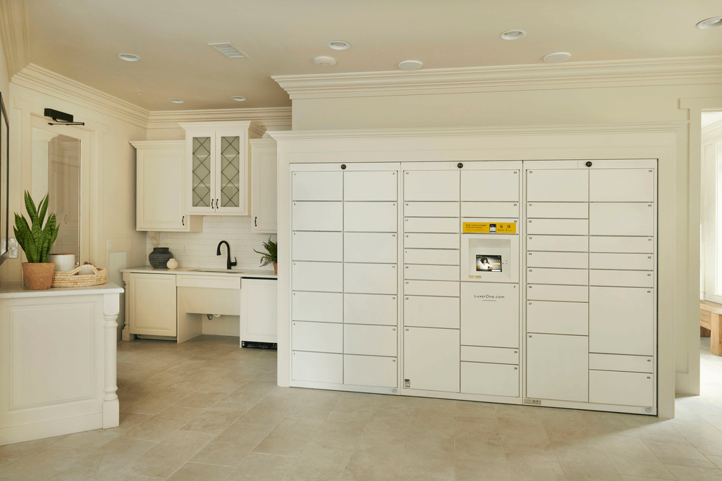a white kitchen with a large white refrigerator and a white