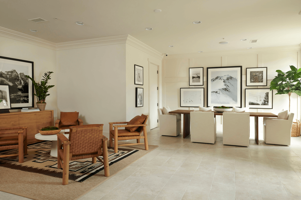 a living room filled with furniture and a table and chairs