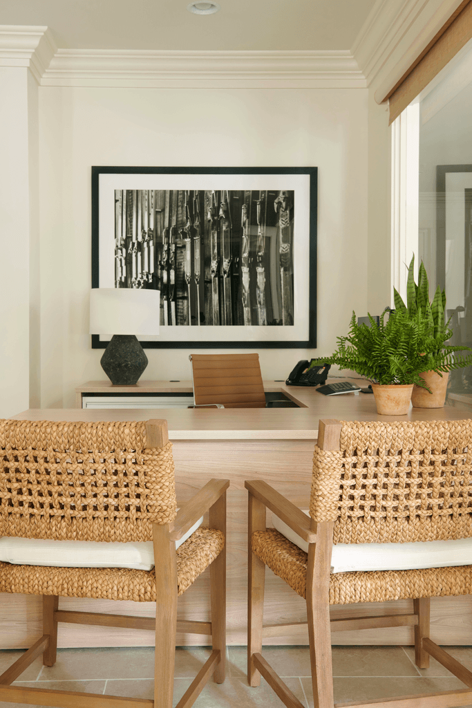 a large room with tables and chairs and a wall with colorful lights