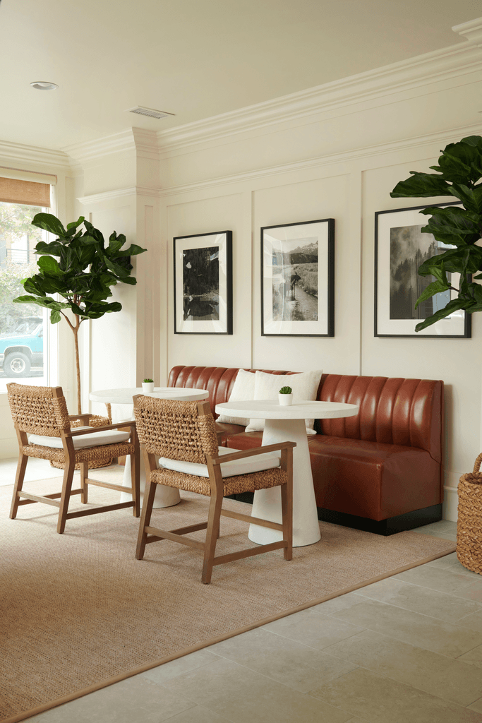 a living room with a table and chairs and a couch