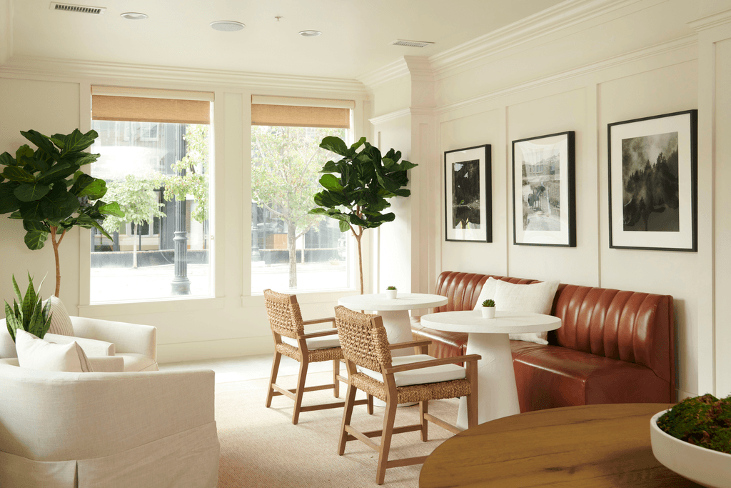 a living room with a table and chairs and a couch