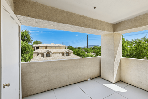 covered patio with a building at The Village at Sun Valley Apartments, Arizona, 85207