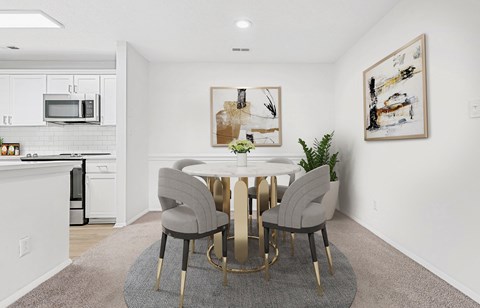 A modern dining room with a white table and grey chairs.