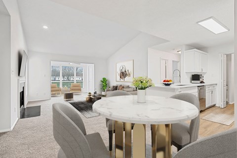 A modern living room with a white marble table and grey chairs.