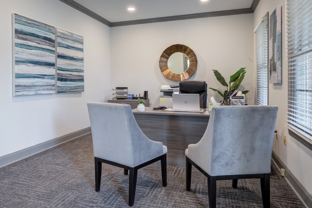 Leasing office with chairs in front of office desk