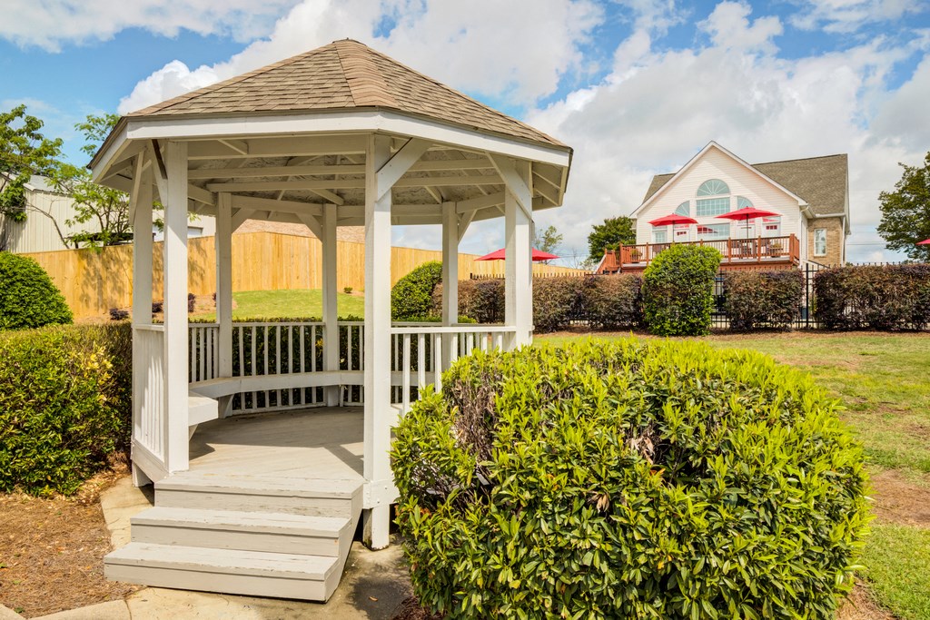 Gazebo surrounded in grass area