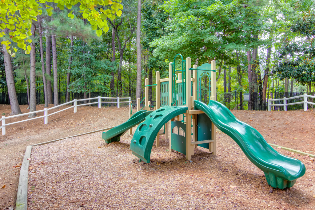 a playground with slides at a park