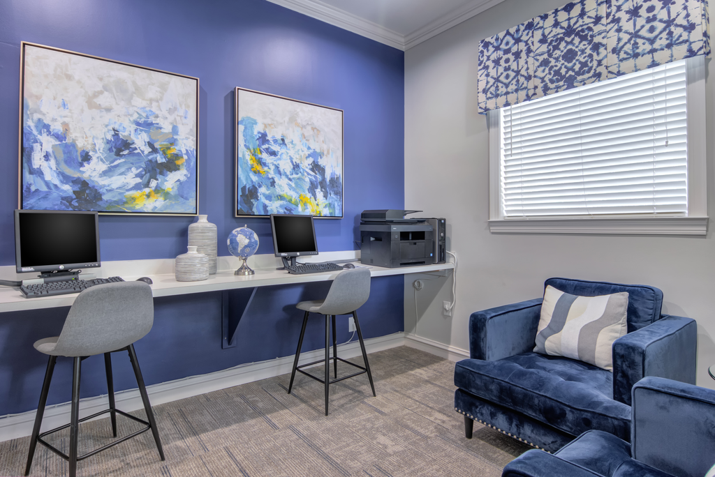 a home office with a desk and a chair and a computer