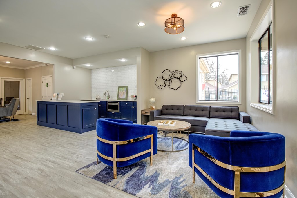 A living room with a blue sofa and a wooden coffee table.