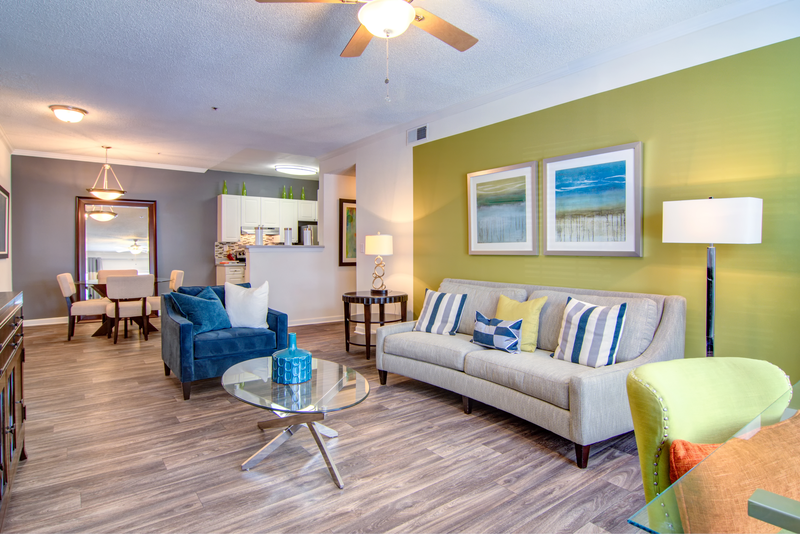 a living room with a couch and chairs and a table