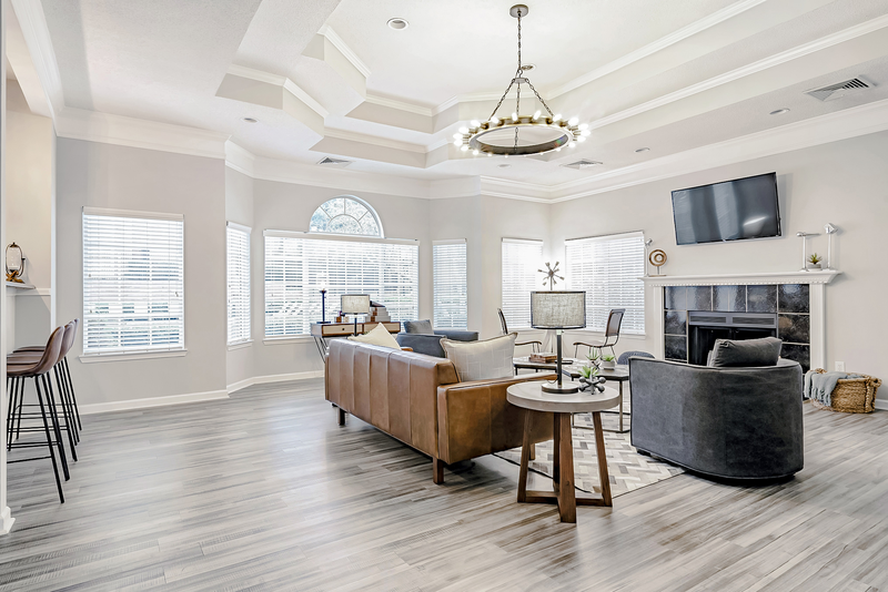 leasing office with leather couch and fireplace