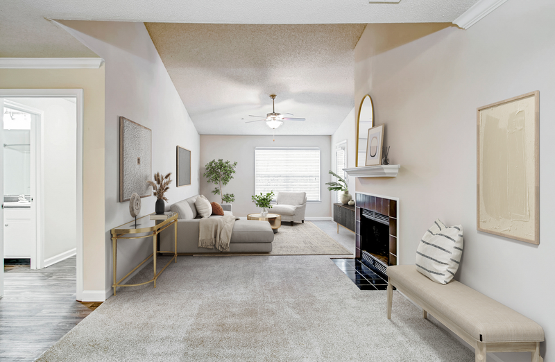 living room with carpet and fireplace