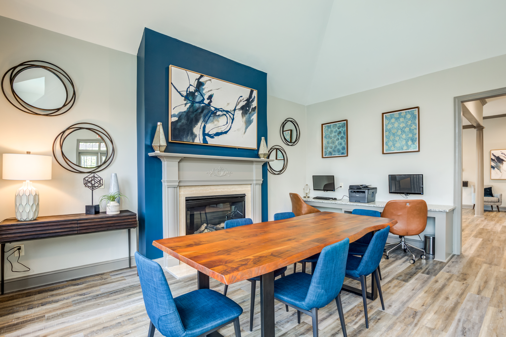 clubhouse interior with fireplace and table seating