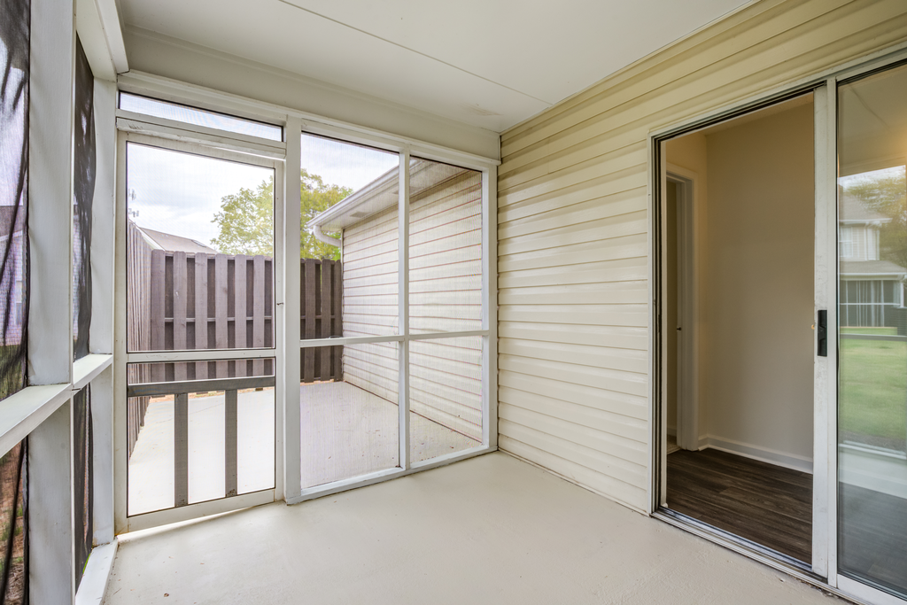 screened in patio with sliding glass doors