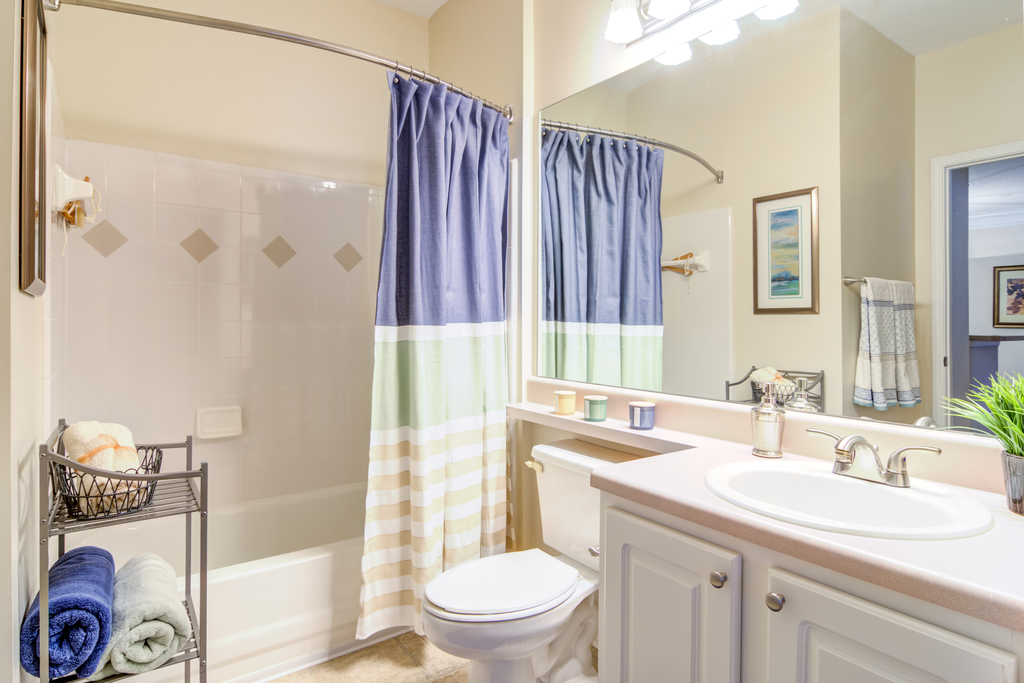 furnished bathroom with tile flooring