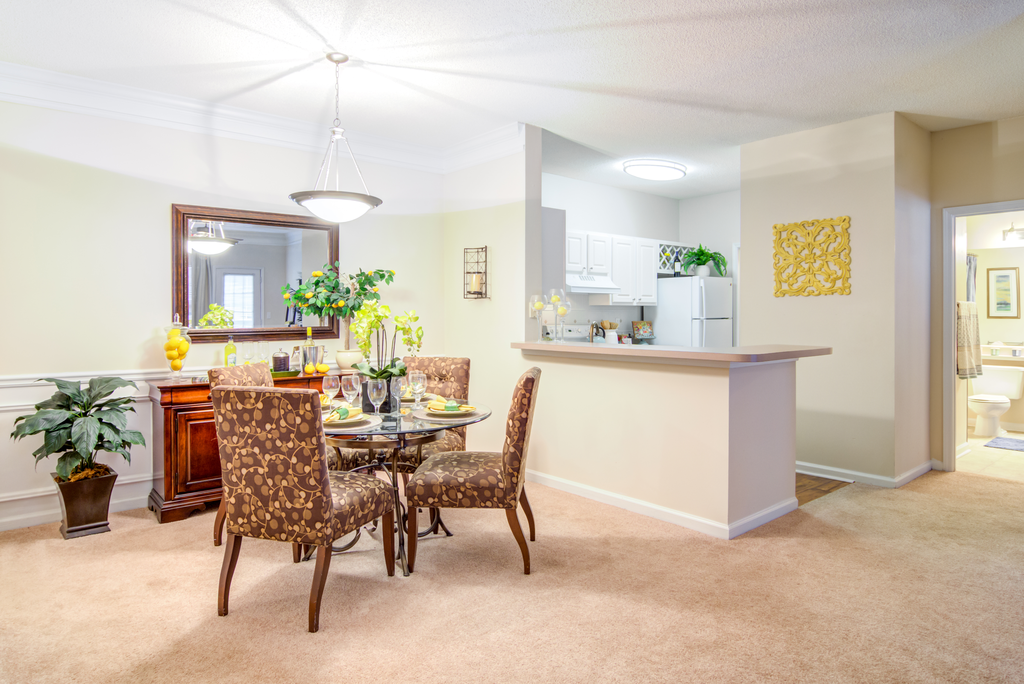 furnished dining room with carpeted flooring