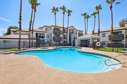 swimming pool with designed walls at The Village at Sun Valley Apartments, Arizona