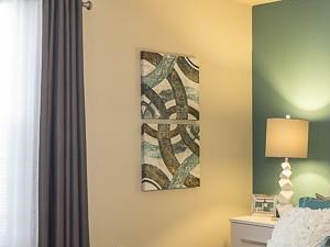 Model Bedroom with White Platform Bed and Headboard with Nightstands