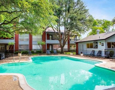Swimming Pool with Apartment building in the background