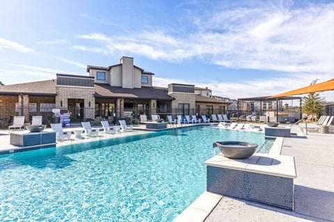 A large swimming pool with a bowl in the middle of it.
