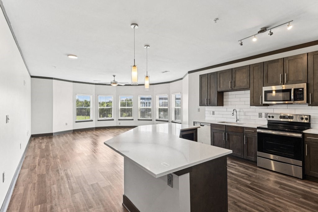 A modern kitchen with a large island in the middle.