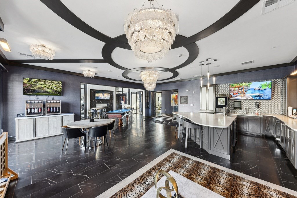A large, modern dining room with a black and white color scheme.