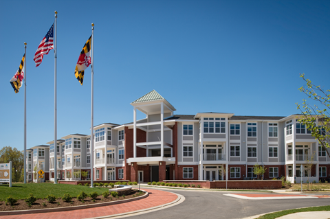 A large building with a flagpole in front of it.