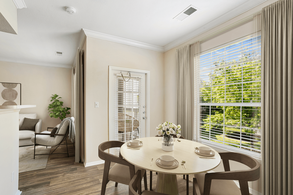 a dining room with a table and chairs