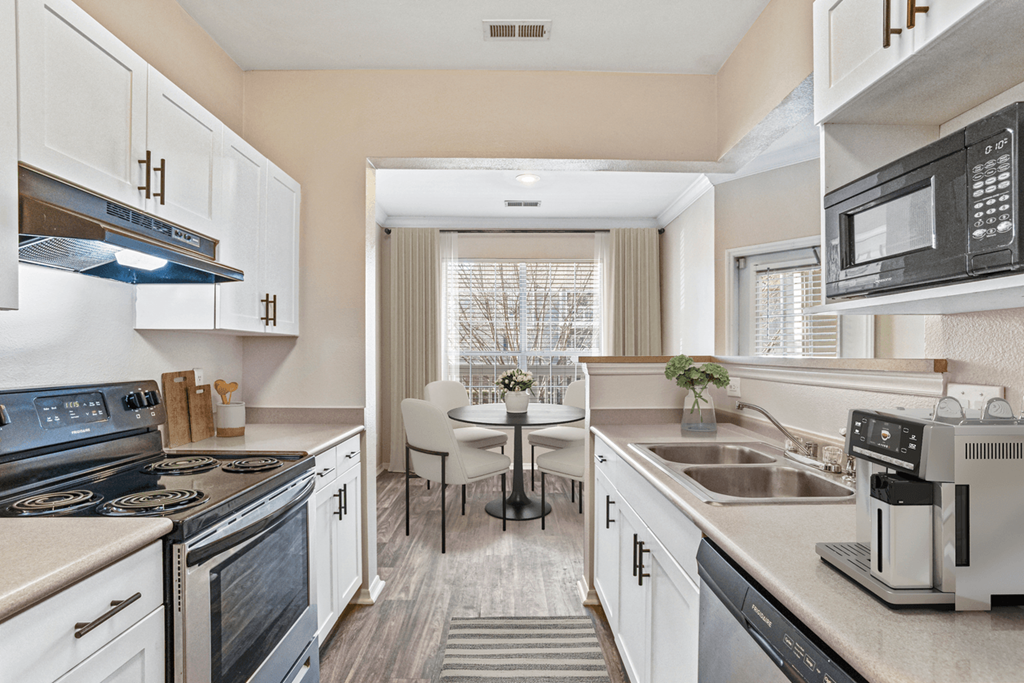 a kitchen and dining area in a 555 waverly unit