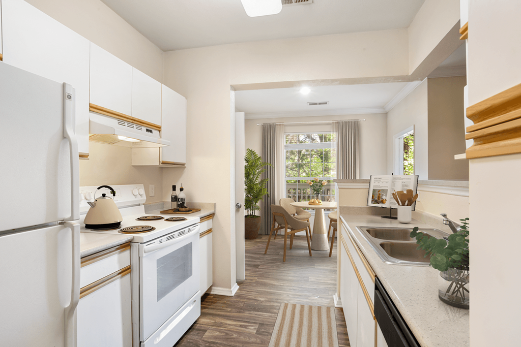 a kitchen and dining area in a 555 waverly unit